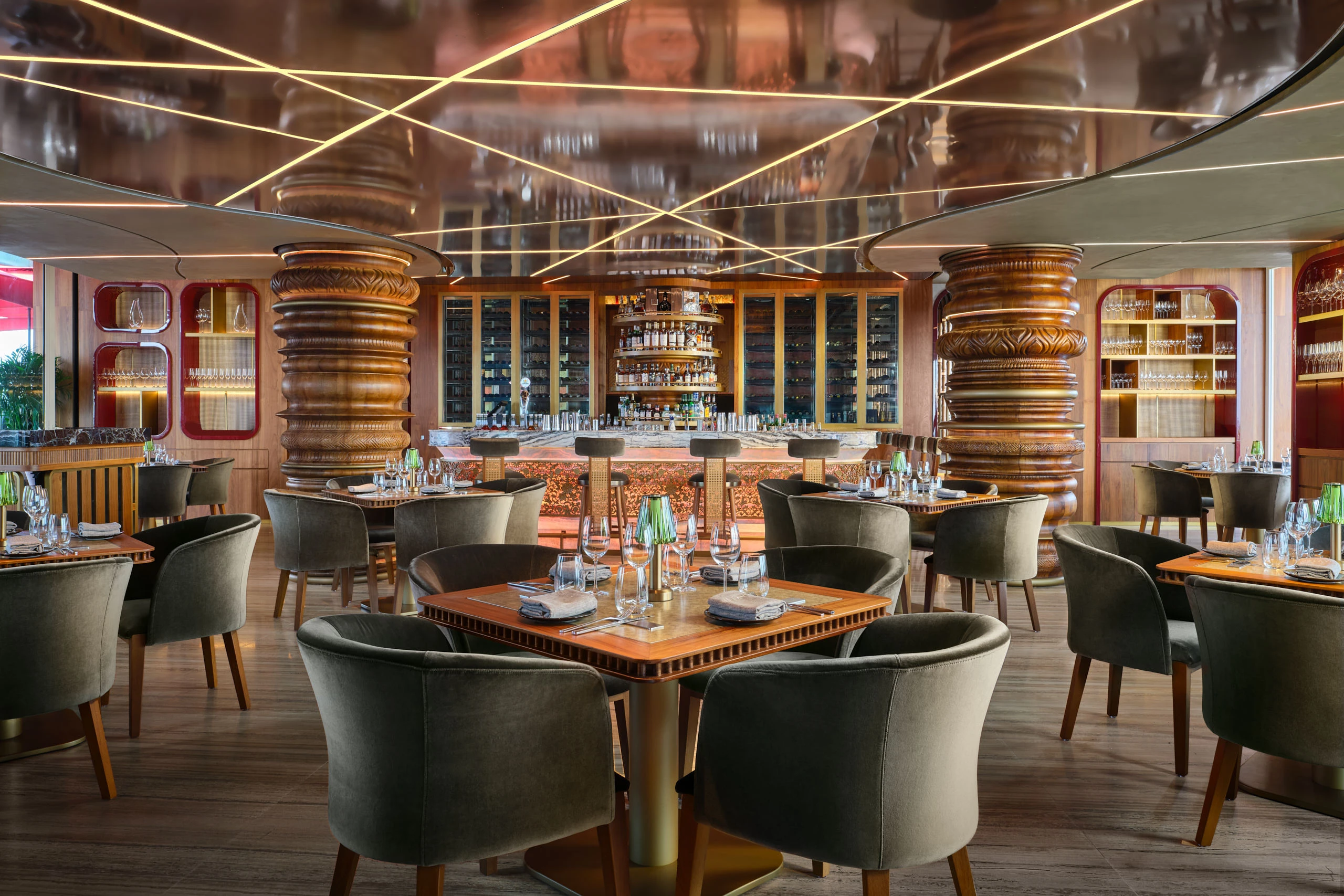 Ce La Vi Singapore restaurant interior with circular booths and detailed ceiling