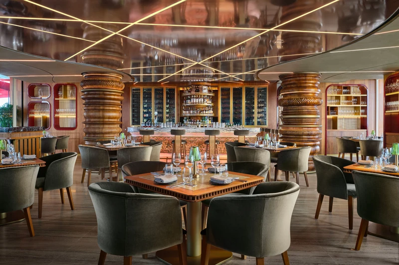 Ce La Vi Singapore restaurant interior with circular booths and detailed ceiling