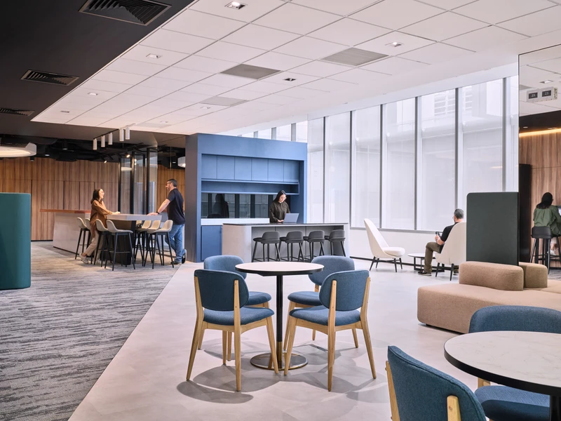 Open-plan collaborative lounge with kitchenette and modular seating