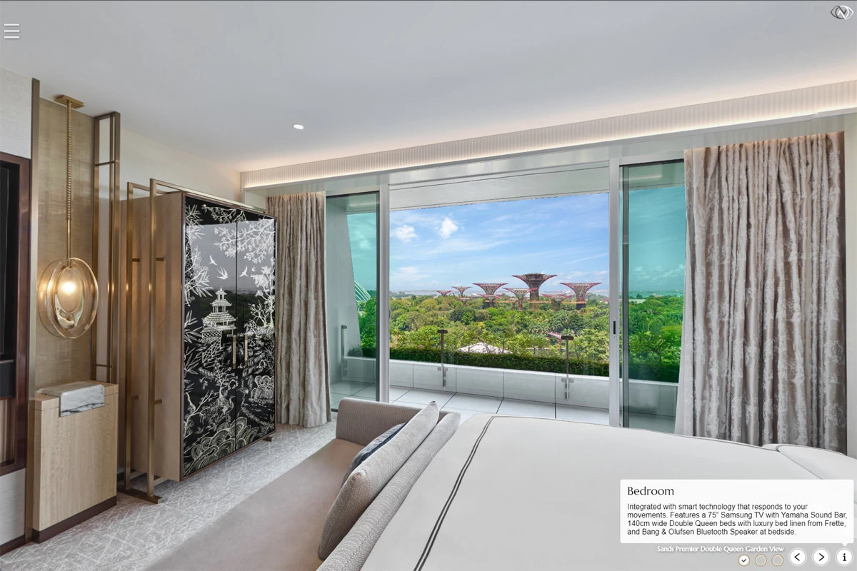 Virtual tour of a luxury hotel bedroom with white bed, black lacquered wardrobe, floor-to-ceiling windows overlooking Supertree Grove and gardens.