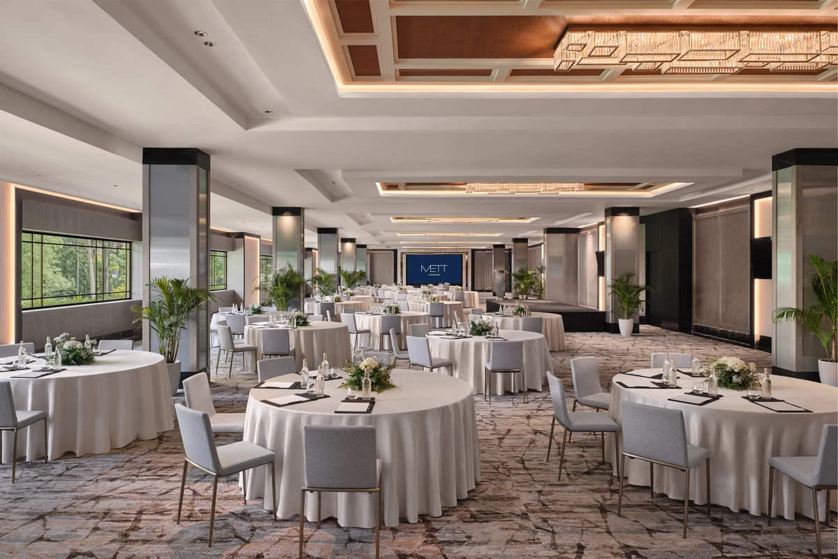 Hotel ballroom cluster setup with stage at METT Singapore