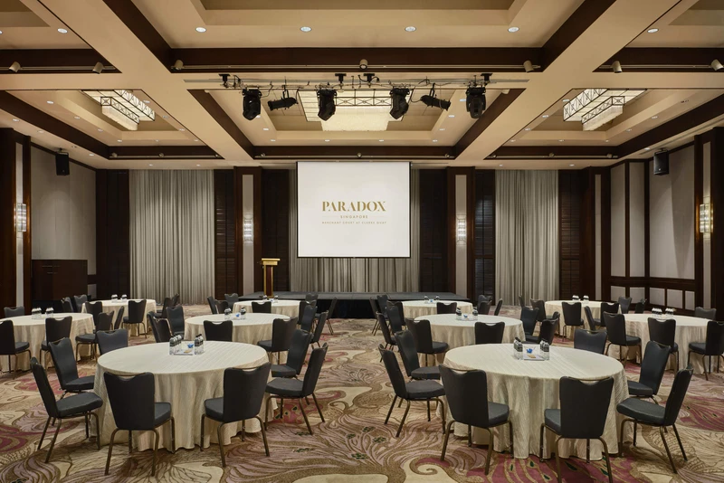 Paradox Singapore ballroom cluster setup with round tables and stage