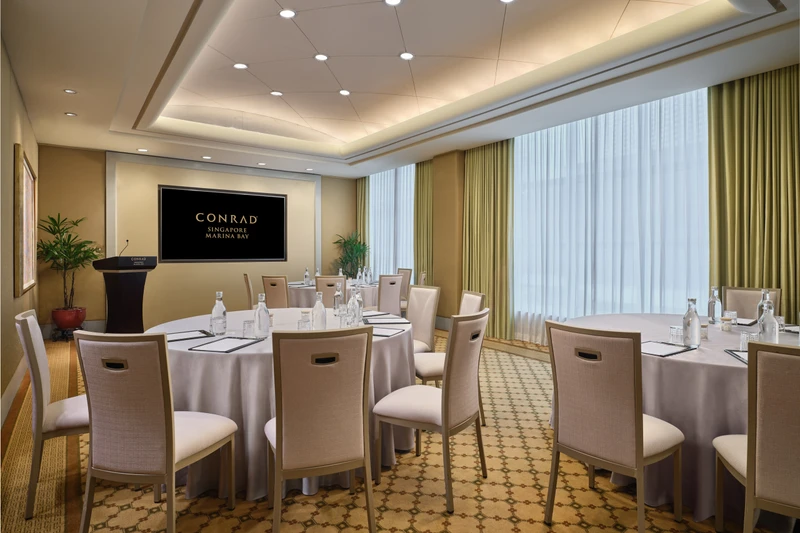 Conrad Singapore Marina Bay Salon 3 in cluster setup with intimate meeting room seating and soft hotel lighting