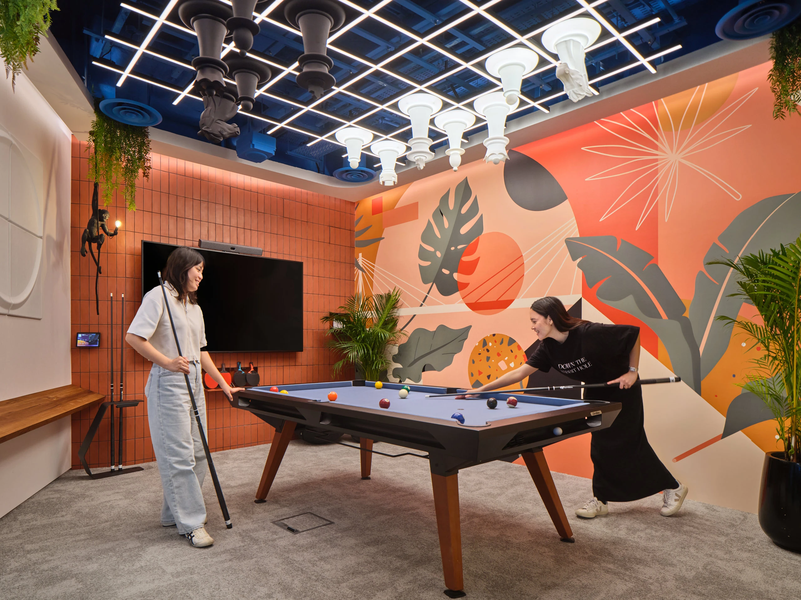 Games room with pool table, ceiling chess set and monkey statue